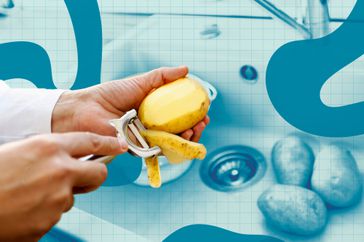 a photo of a person peeling a potato over the kitchen sink