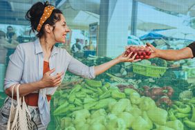 woman shopping at a farmer's market