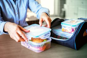 A woman's hands packing a lunch to take to work