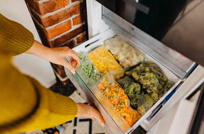an image of a freezer filled with frozen veggies