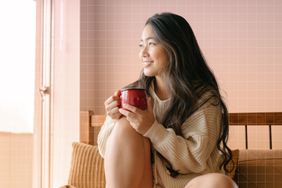a photo of a woman drinking a cup of tea 