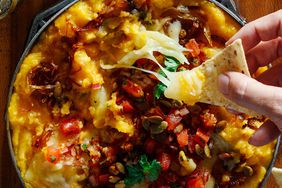 a cast iron skillet with a cheesy dip