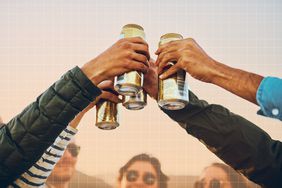 a group of friends raising their cans of beers for a cheers
