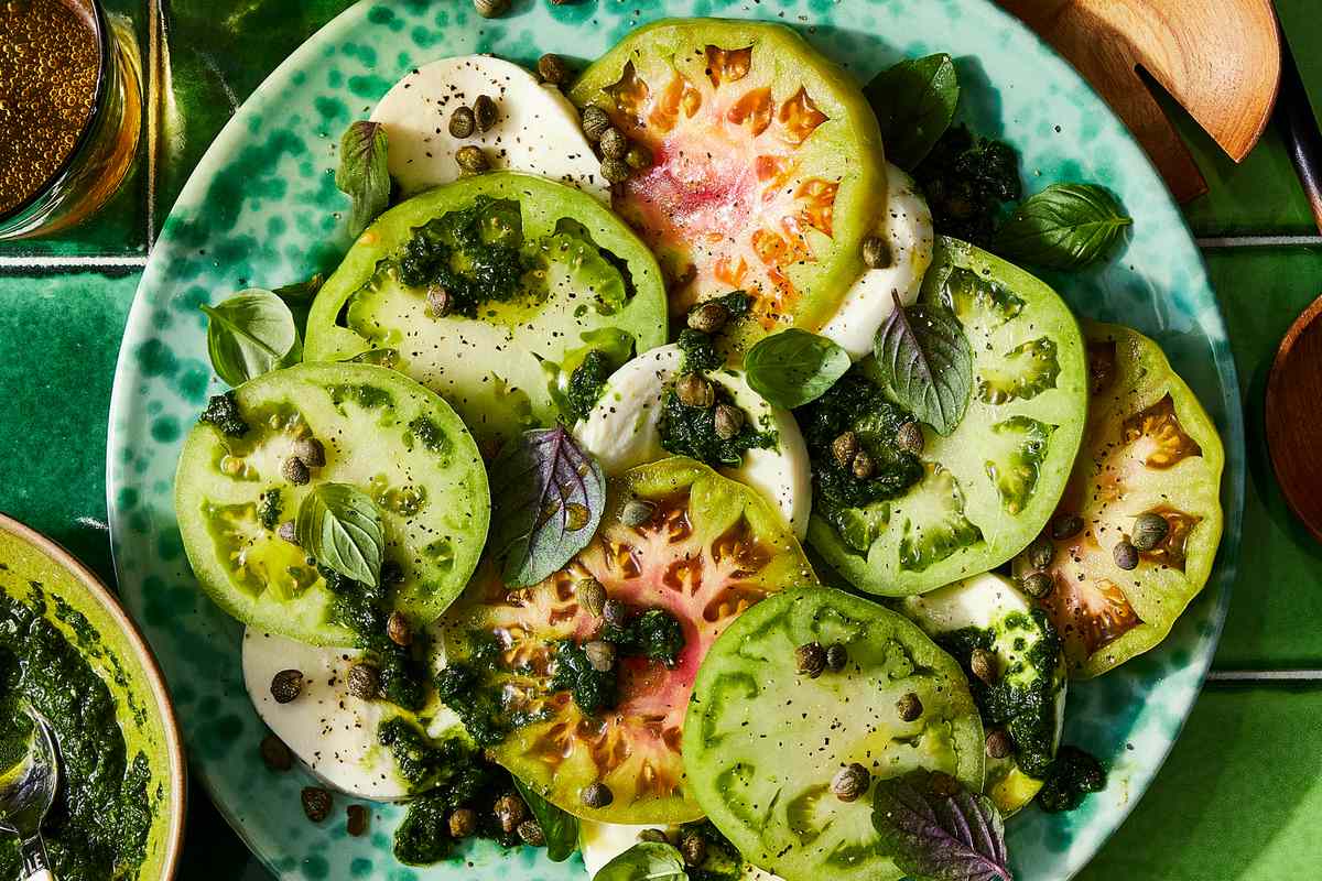 a recipe photo of the Caprese Salad with Basil & Tarragon Chimichurri served on a plate