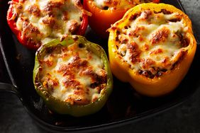 Overhead view of a baking dish of Cauliflower Rice-Stuffed Peppers recipe