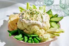Side view of a plate of Creamy Loaded Cauliflower Dip recipe