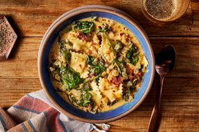 a recipe photo of the Creamy Sun-Dried Tomato & Spinach Soup with Ravioli