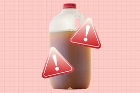 a photo of a half gallon plastic jug of apple cider with exclamation warning labels