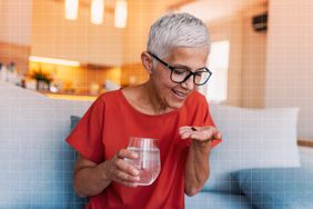 a photo of an older woman taking her multivitamin