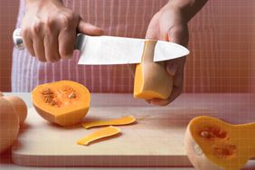 a photo of a person peeling a butternut squash