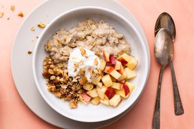 Overhead view of a white bowl of Oatmeal with Fruit & Nuts recipe