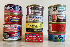 cans of salmon sitting on countertop group shot