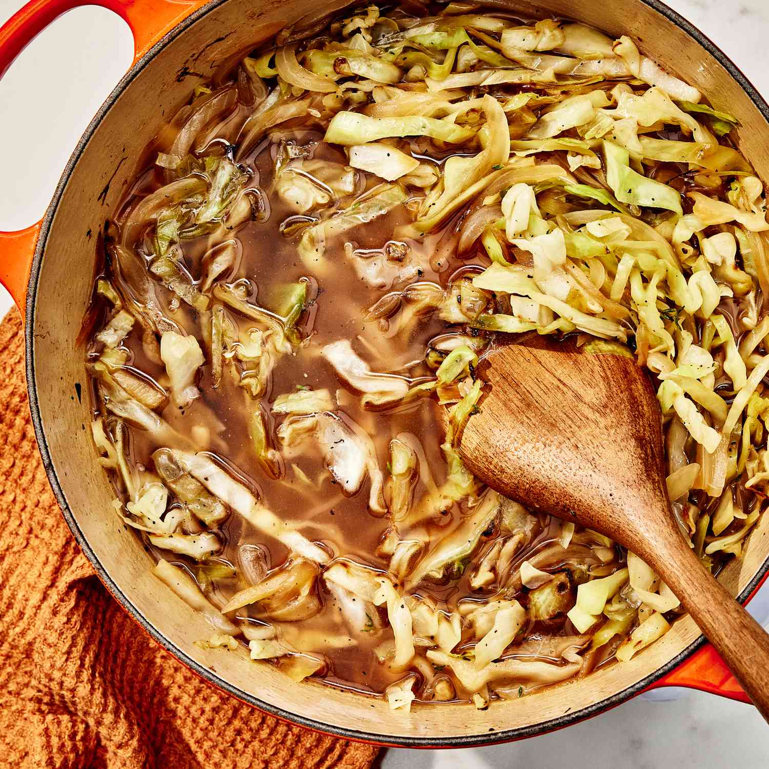 an image of the broth added to the cabbage 