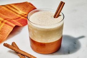 an image of the Whipped Frozen Apple Cider served with a cinnamon stick