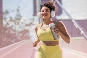 a photo of a woman jogging outside 