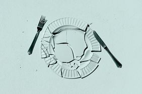 a photo of a broken plate and scattered fork and knife