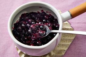 Overhead view of Easy 3-Ingredient Blueberry Compote recipe in a white serving bowl
