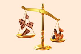 A golden scale with chocolate bars on one side and cocoa beans on the other