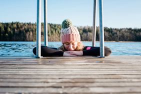 Image of a woman doing a cold plunge