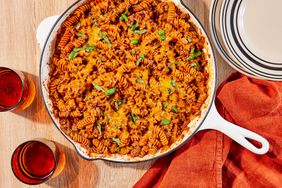 overhead shot of cheesy beef pasta in a white skillet
