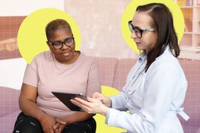 a photo of a doctor speaking to their patient