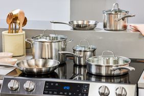 a photo of the various stainless steel pots and pans on a stove top 