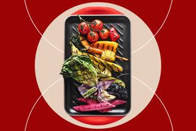 a photo of the Le Creuset Grill Plan with a colorful arrangement of grilled vegetables 
