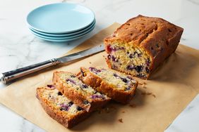 Lemon-blueberry poke cake, half of it sliced up
