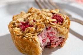 a recipe photo of the Lemon-Raspberry Cream Cheese Oatmeal Cakes served on a plate and cut open