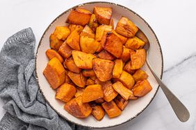 Overhead view of a bowl of Maple-Roasted Sweet Potatoes recipe