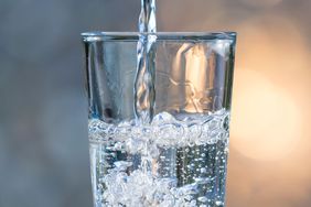 mineral water being poured into clear glass