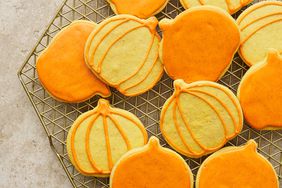 Pumpkin shaped sugar cookies with orange frosting