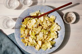 The roasted cabbage salad recipe in a light blue bowl