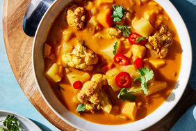 Overhead view of a bowl of Roasted Cauliflower & Potato Curry Soup recipe