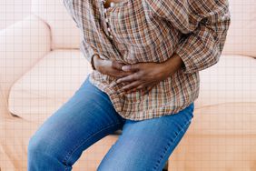 a photo of a person holding their stomach