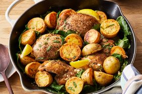 Angled view of a skillet of Skillet Lemon Chicken & Potatoes with Kale recipe