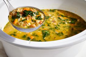 Slowcooker Bean Kale and Barley Soup in a ladle