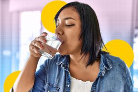 a photo of a woman drinking a glass of water