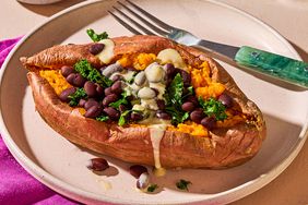 Stuffed Sweet Potato with Hummus Dressing, low angle on a plate
