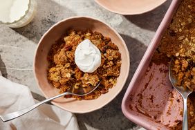 Sweet potato dump cake in a bowl, topped with a whipped cream dollop