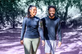a photo of a couple walking in the outdoors