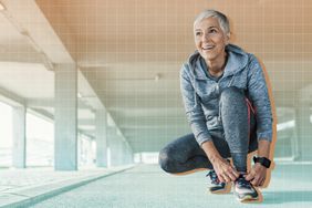 a photo of a woman squatting down to tie her shoe before exercising