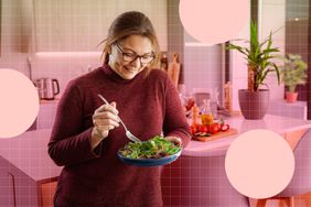 a photo of a woman eating a salad