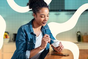 a photo of a woman having a snack in the kitchen