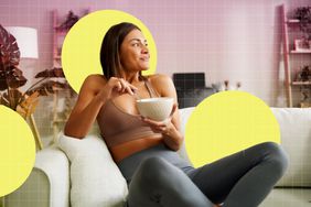 a photo of a woman having a snack on a couch
