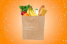 a photo of a paper bag full of groceries