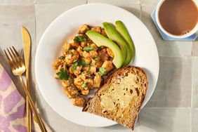 a recipe photo of the Tofu Scramble with Peanut Ginger Sauce and Avocado with a slice of whole grain toast