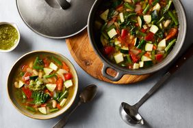 overhead shot of vegetable soup in a black cast iron pot
