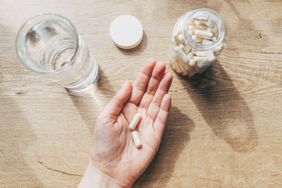 a photo of a hand holding supplements