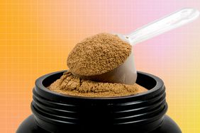 a container of protein powder with a scoop coming out